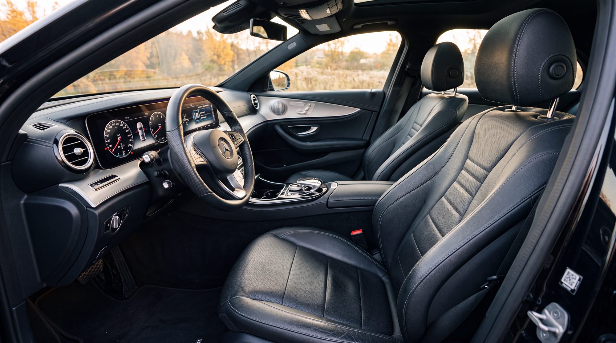 Spotless black leather interior and dashboard of a luxury sedan